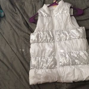 Girls puffy white vest with silver sequins.